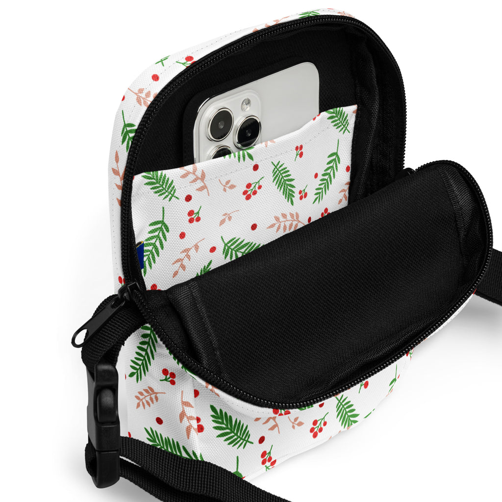 White winter fern and berry christmas women’s crossbody purse with green red foliage pattern black zipper strap