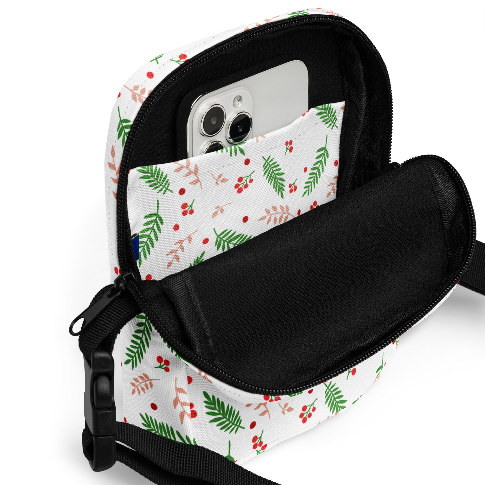 White winter fern and berry christmas women’s crossbody purse with green red foliage pattern black zipper strap