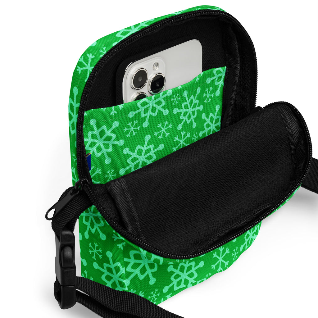 Girls green snowflakes crossbody purse with adjustable strap and black interior for convenient everyday use