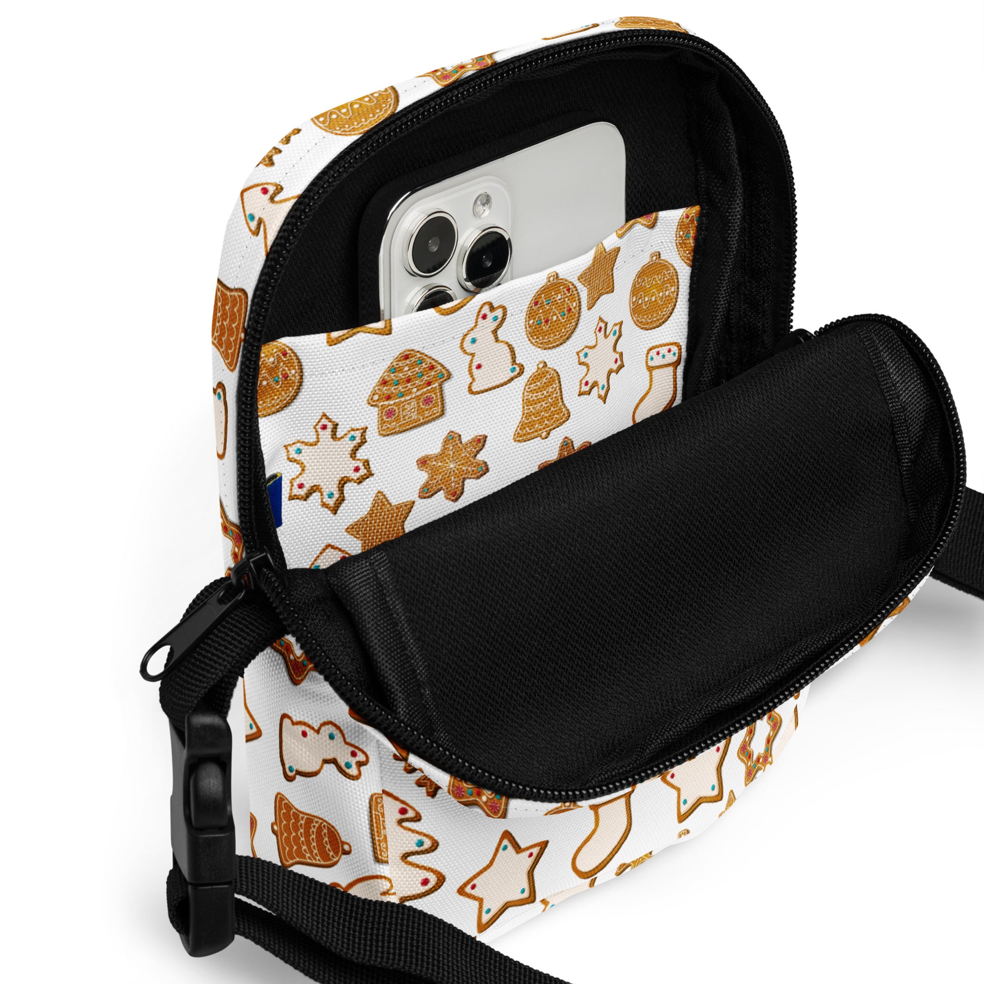 White crossbody phone pouch with festive gold gingerbread cookie pattern and black zipper accents for christmas use