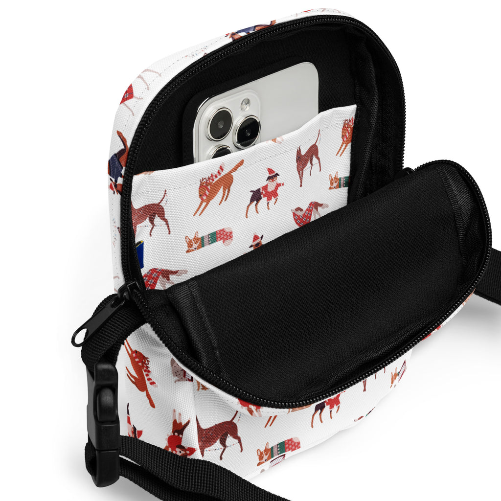 White canvas girls christmas dogs crossbody purse with festive red and brown holiday dogs and black straps and zippers