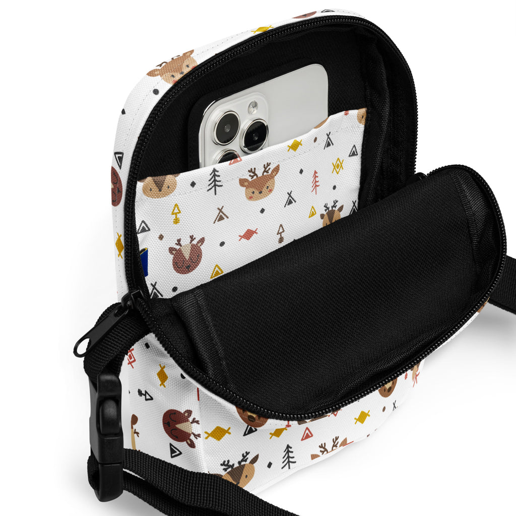 White canvas crossbody bag with playful woodland pattern featuring brown deer yellow fish and black teepees for girls