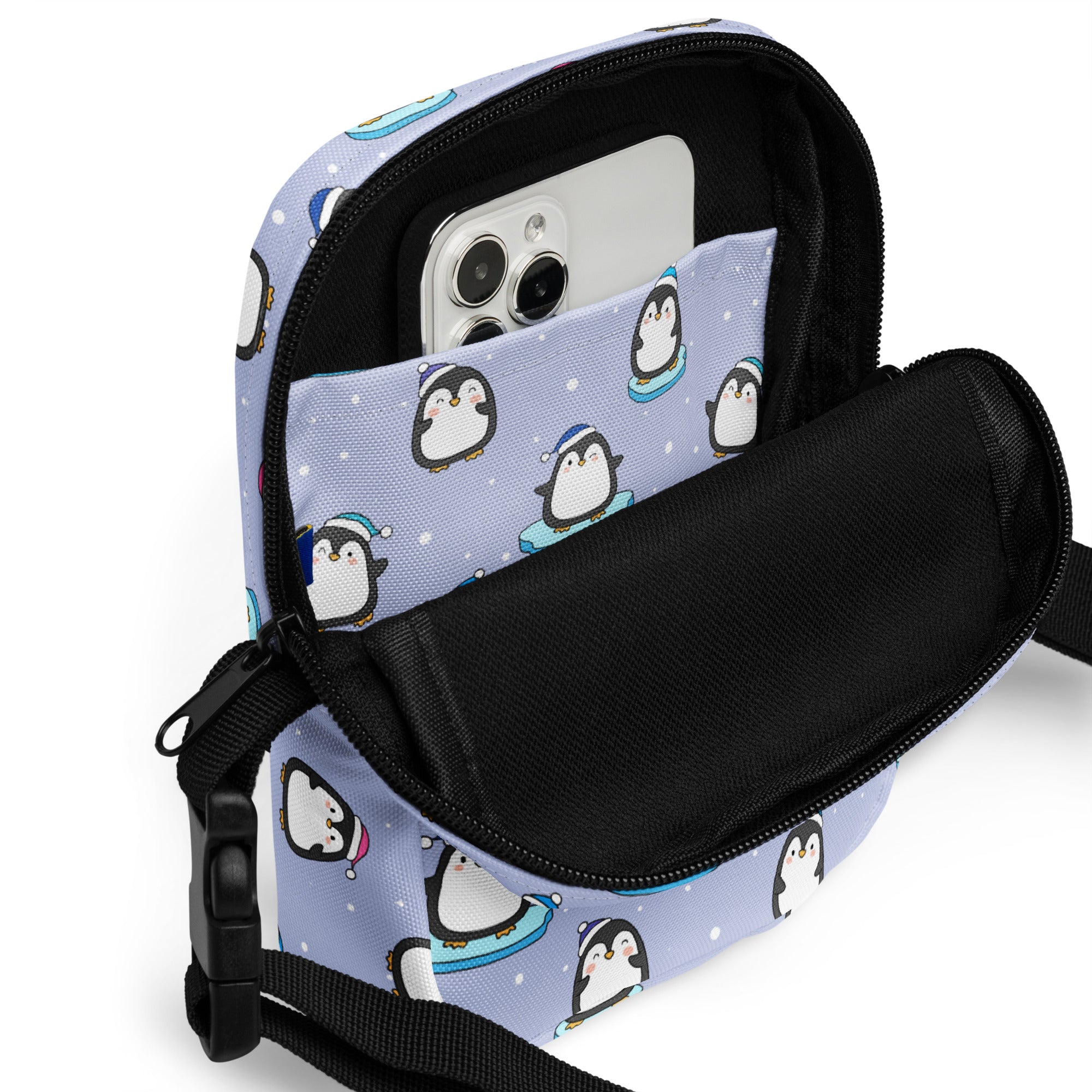 Light blue penguin-themed crossbody phone pouch with black zipper and strap for women’s winter use