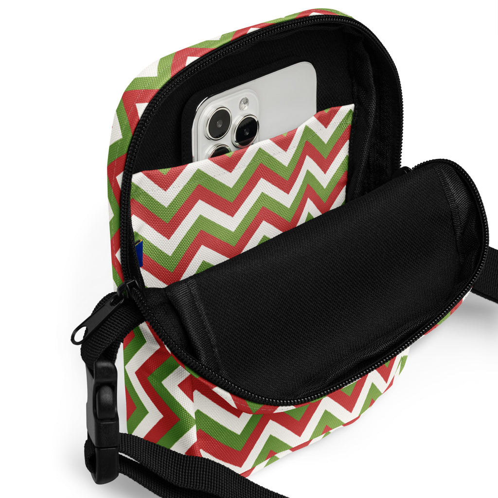 Girls Christmas chevron crossbody purse with festive red green white zigzag pattern and black interior lining