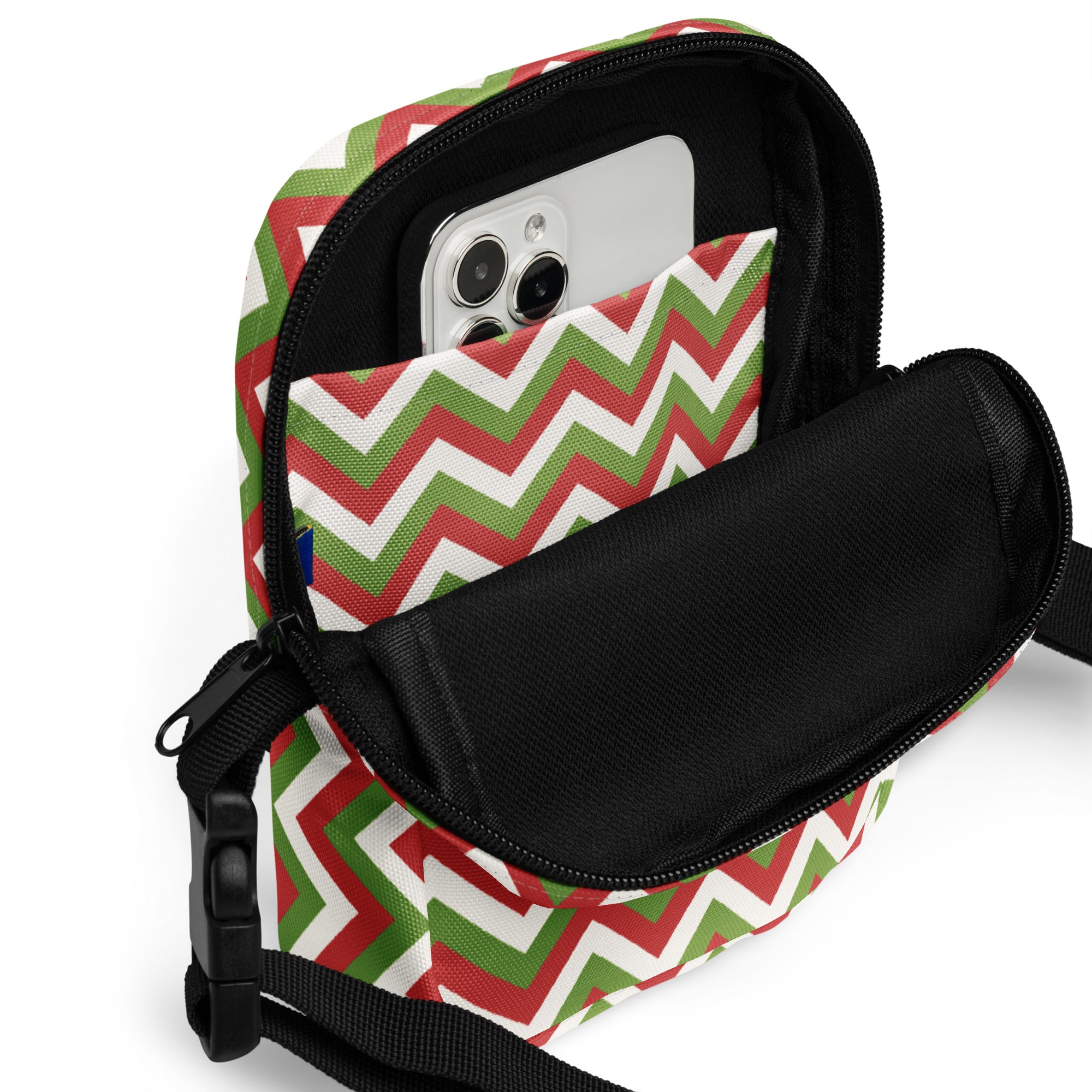 Christmas chevron women’s crossbody purse with festive red green white zigzag pattern and black interior lining