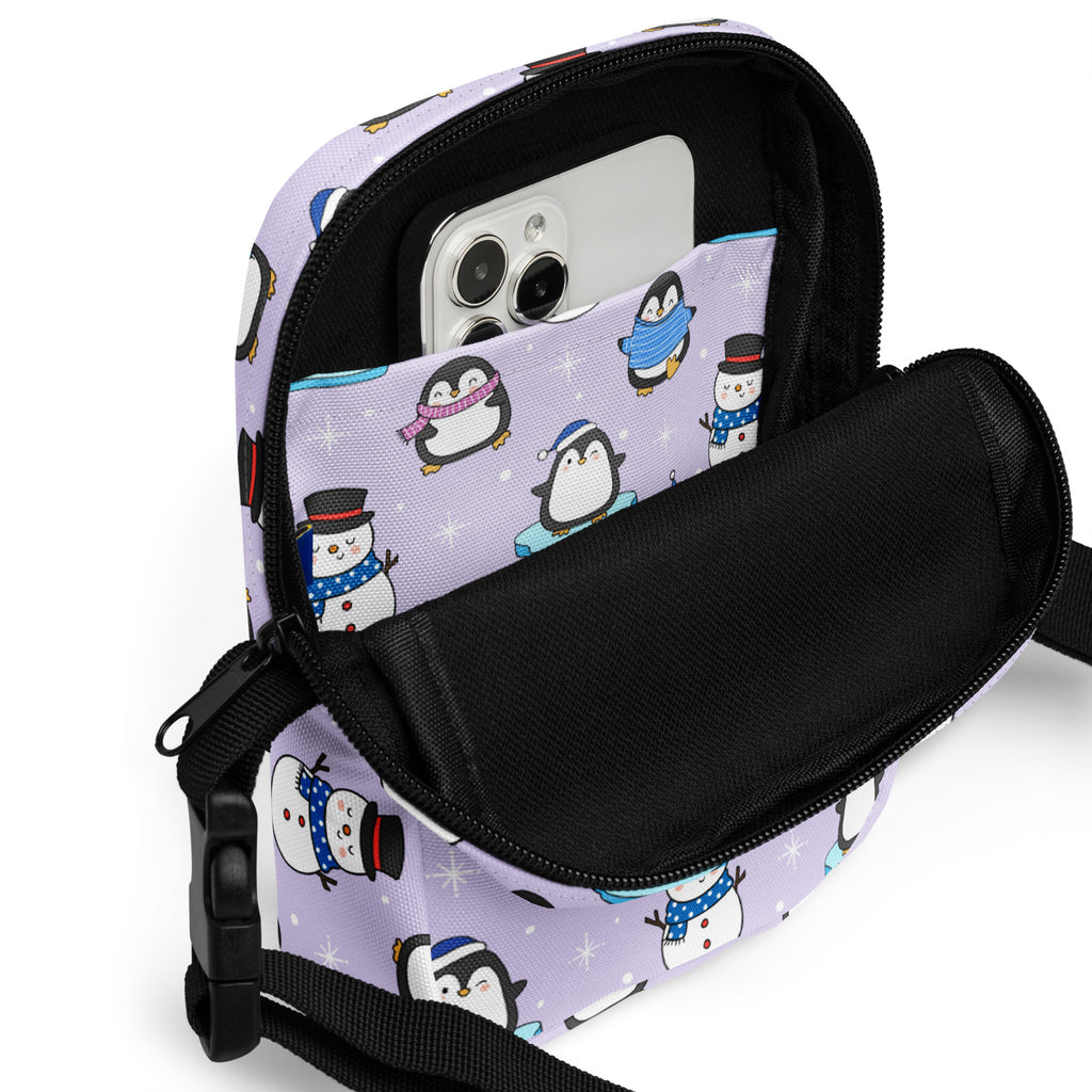 Girls winter penguin crossbody purse with lavender pattern snowman design and black zipper phone pouch accents