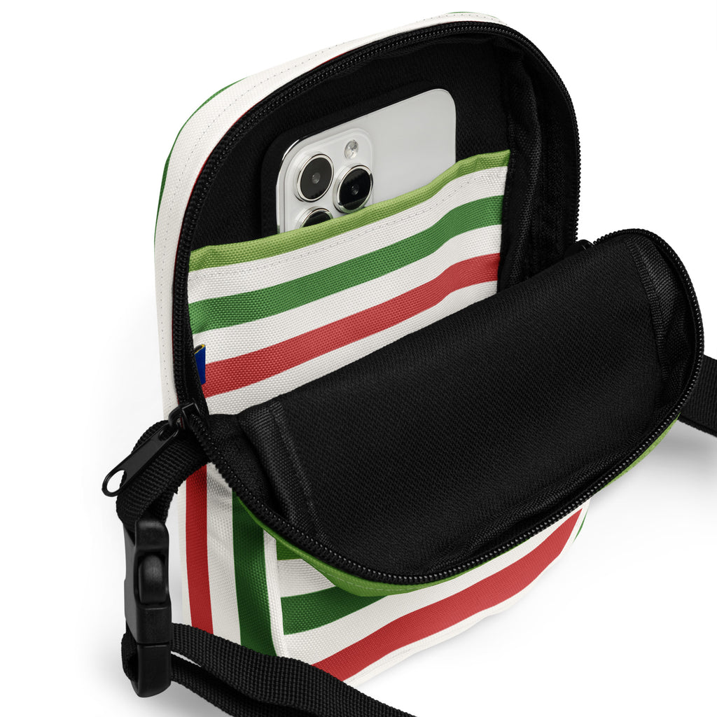 Christmas striped women’s crossbody purse with white body, red and green horizontal stripes, black interior, detachable strap