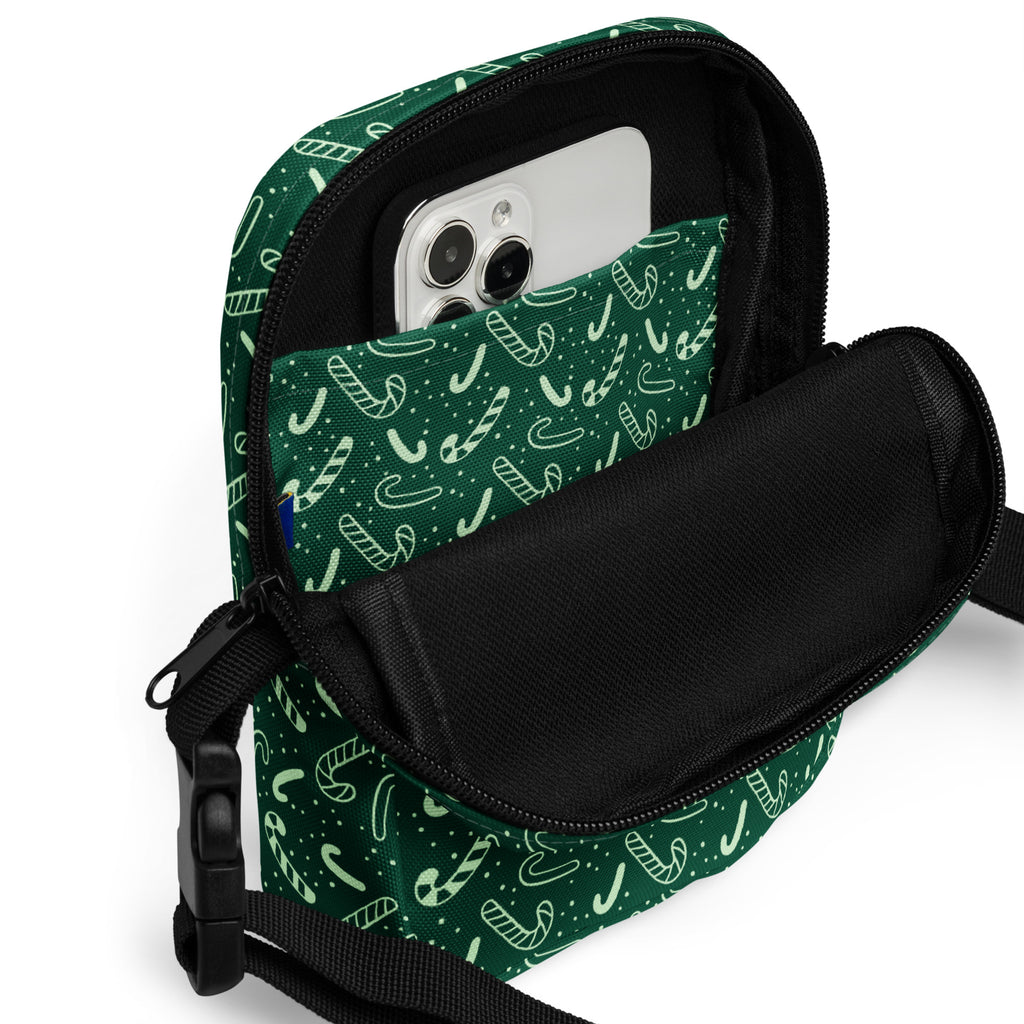 Girls green candy cane crossbody purse with candy cane pattern black zipper and strap for Christmas use
