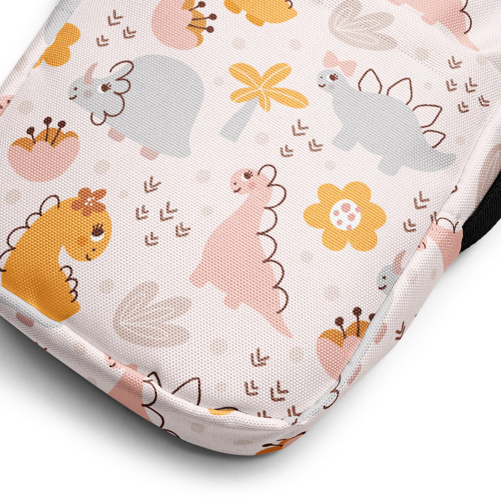 Girls floral dinosaur crossbody purse with soft white fabric and pastel dinosaur and flower pattern in pink yellow and gray