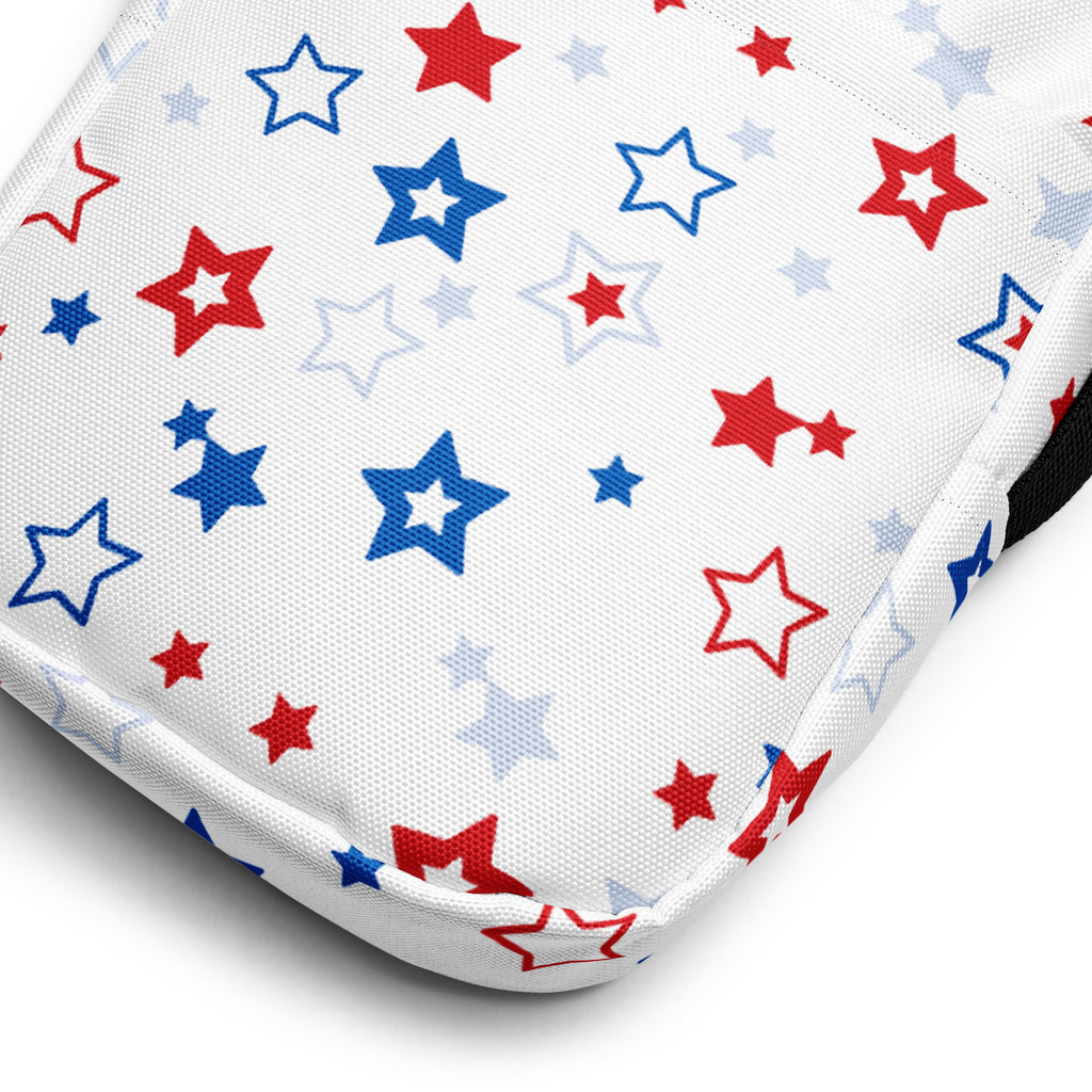 White fabric crossbody purse for girls with red white and blue star pattern and playful design