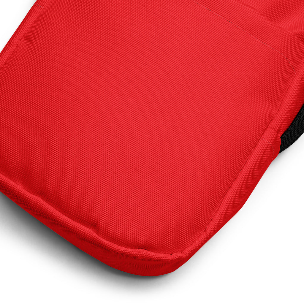 Girls red crossbody purse with a textured weave red fabric cushion and stitched edges
