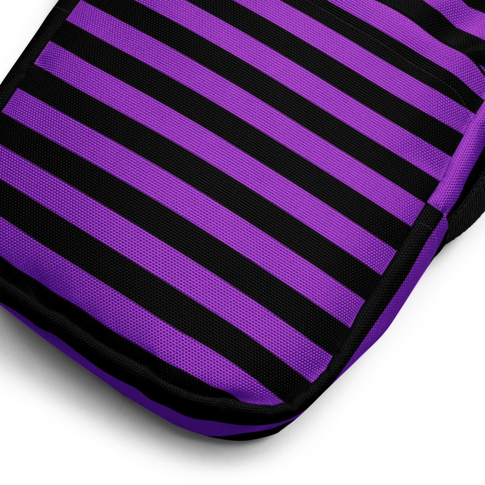 Girls purple and black striped Halloween crossbody purse with a textured woven fabric bag design