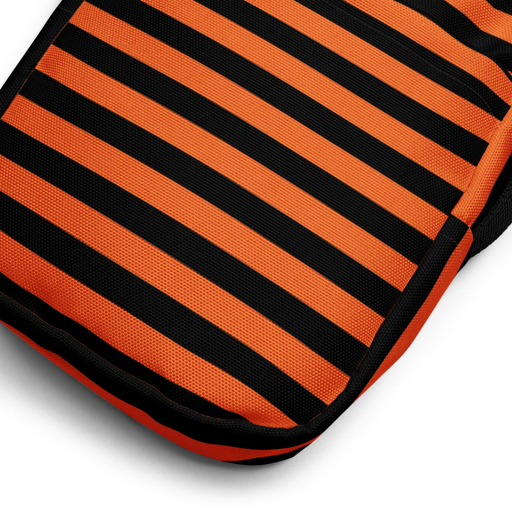 Girls orange and black striped Halloween crossbody purse with textured fabric and outdoor cushion design detail