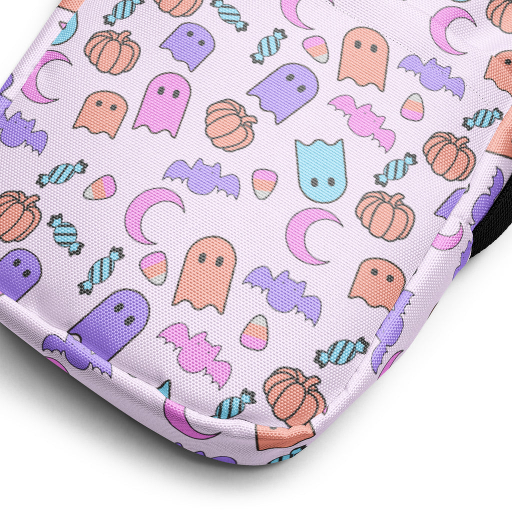 Girls ghost halloween crossbody purse made of pastel lavender fabric pouch with colorful ghosts bats pumpkins and candy pattern