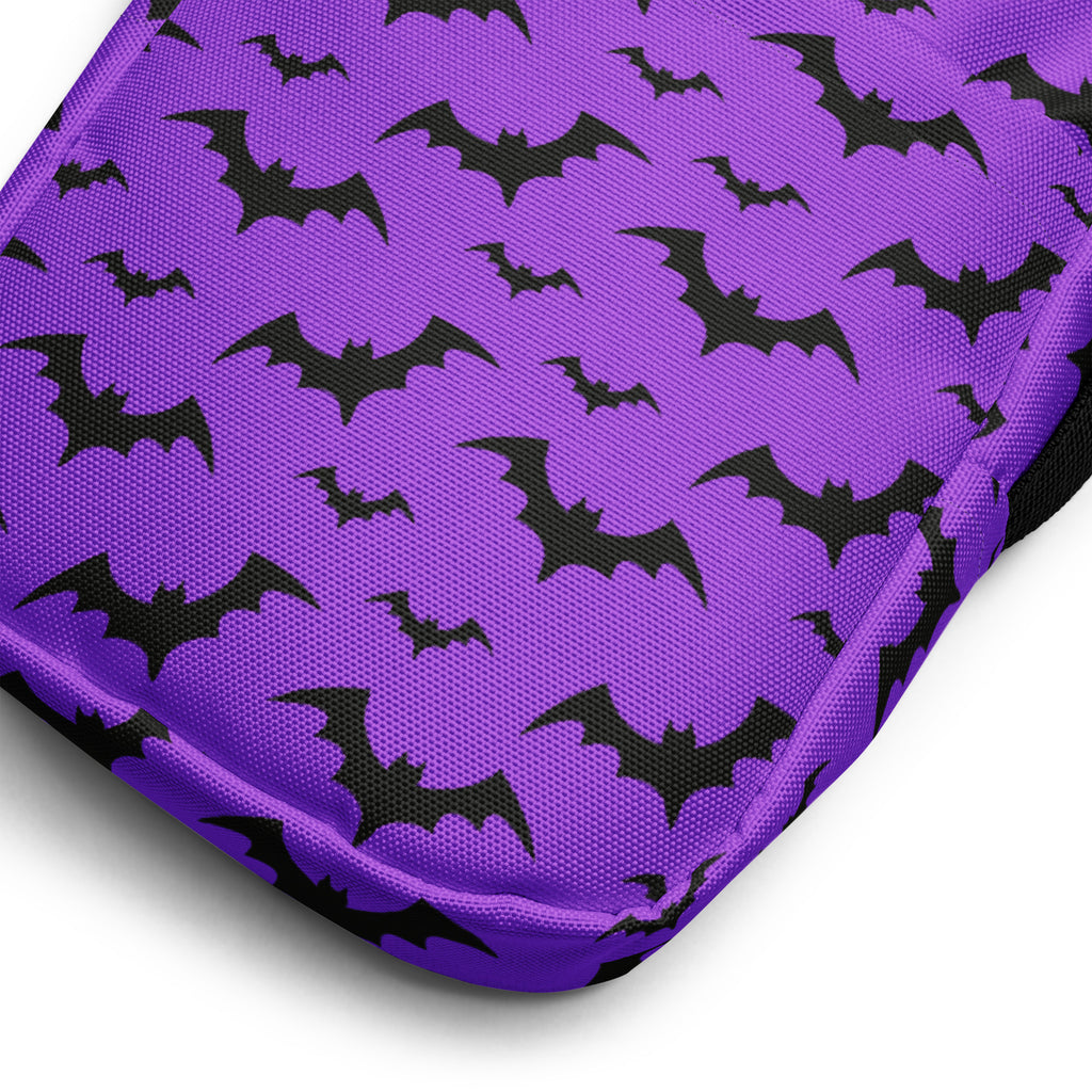 Kids purple bats halloween crossbody purse featuring a purple cushion with a black bat pattern