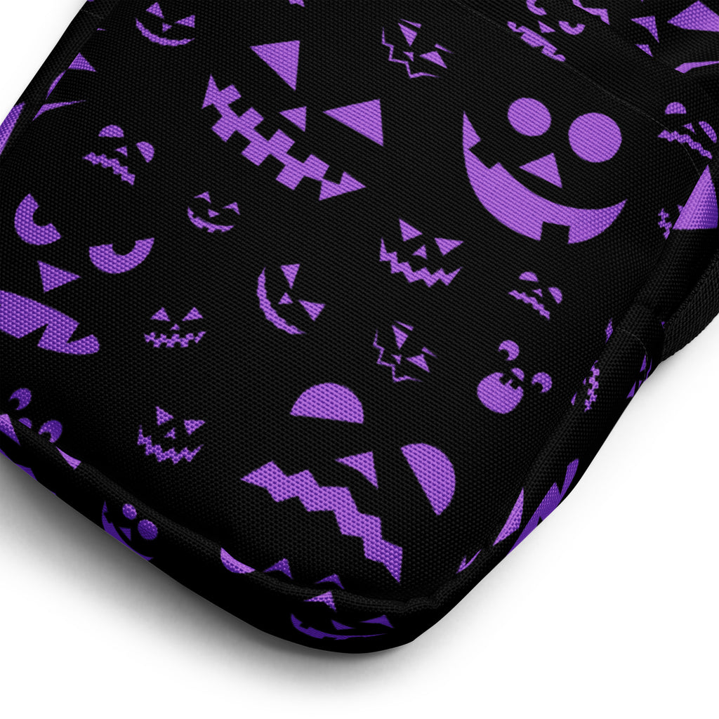 Black fabric crossbody purse with purple halloween jack-o-lantern faces for girls in various sizes and styles
