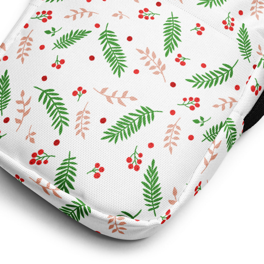 White winter fern and berry Christmas women’s crossbody purse with white fabric cushion featuring green and blush-pink leaves and red berries