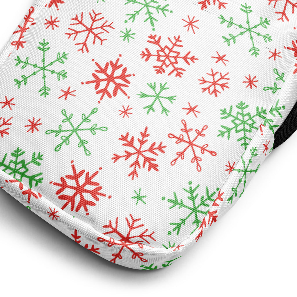 White fabric girls crossbody purse with red and green snowflake patterns perfect for festive use