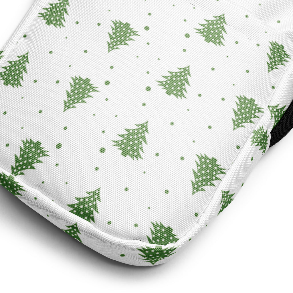 White fabric crossbody purse with green pine tree pattern and dotted accents for christmas winter style