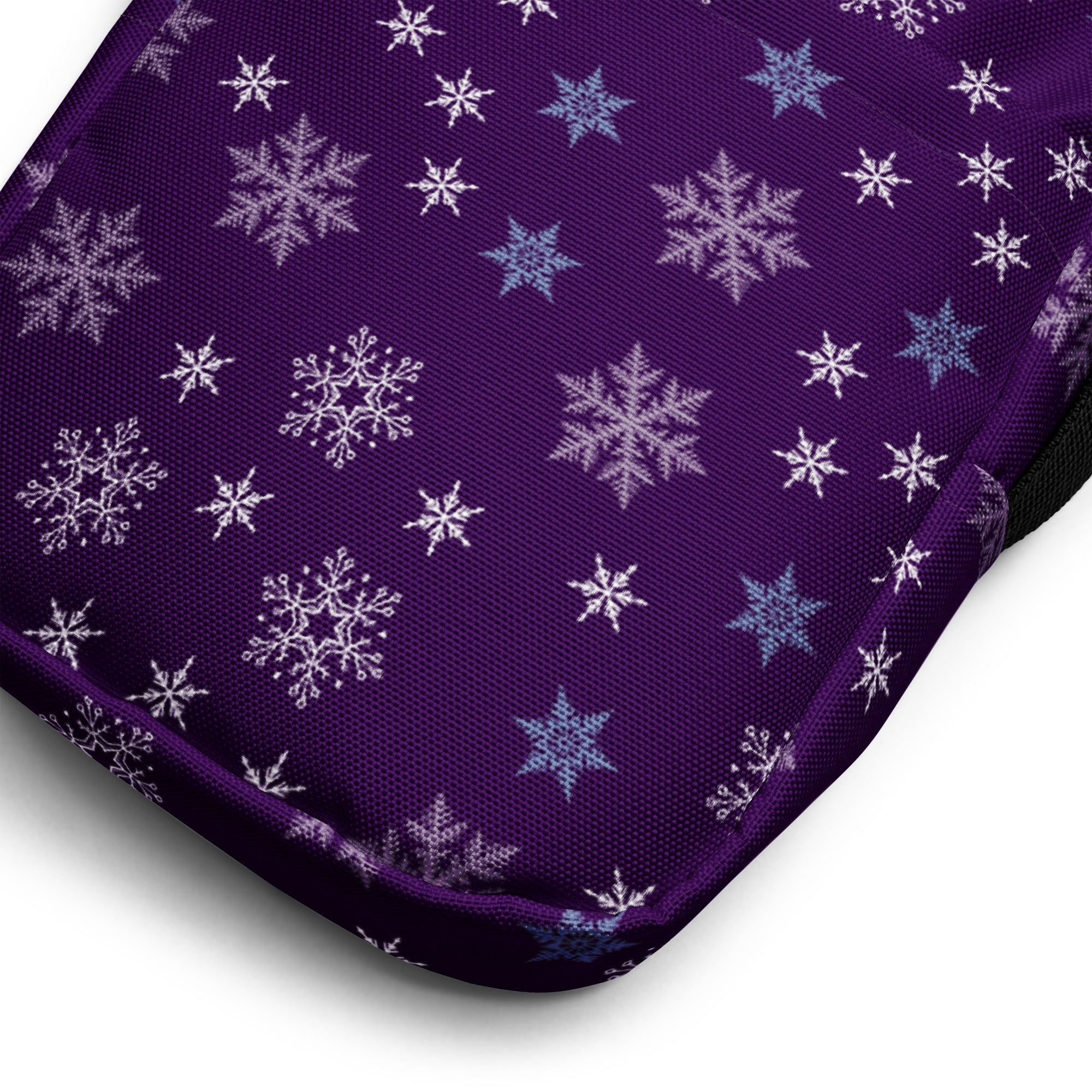 Christmas purple snowflake winter women crossbody purse with a purple fabric cushion patterned with white and light blue snowflakes