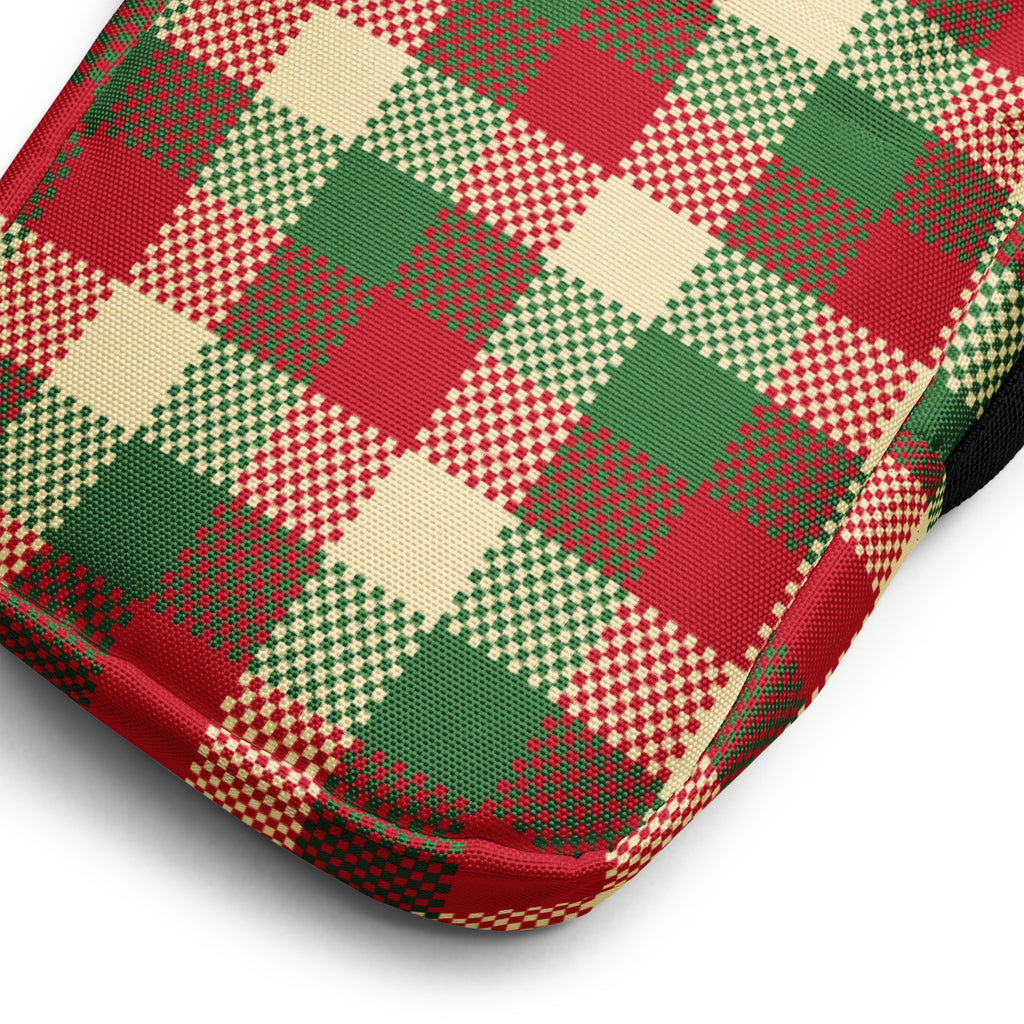 Girls holiday plaid crossbody purse featuring a red green and cream plaid woven textile cushion pattern
