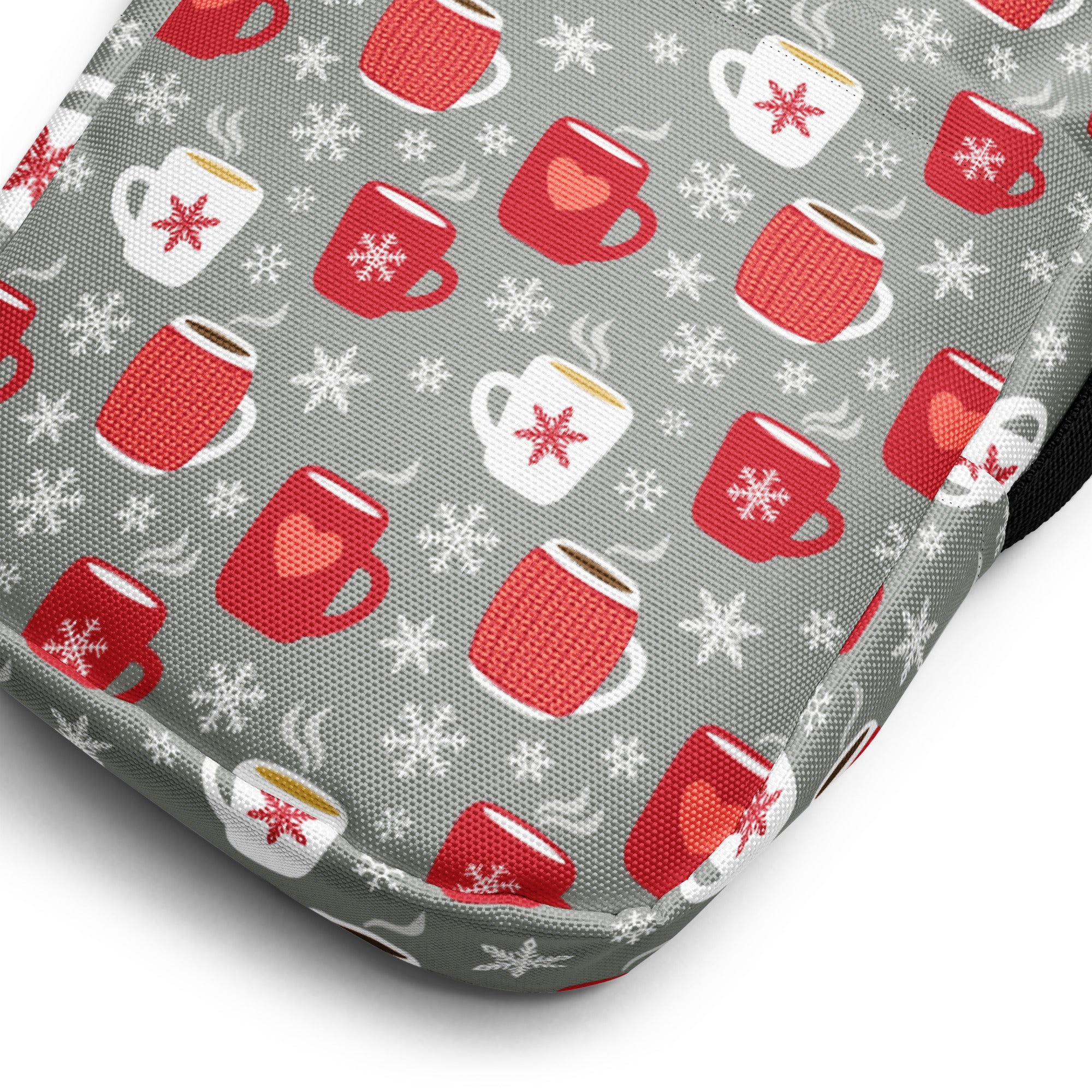 Gray fabric crossbody purse with cozy winter mugs pattern featuring red and white coffee mugs and snowflakes