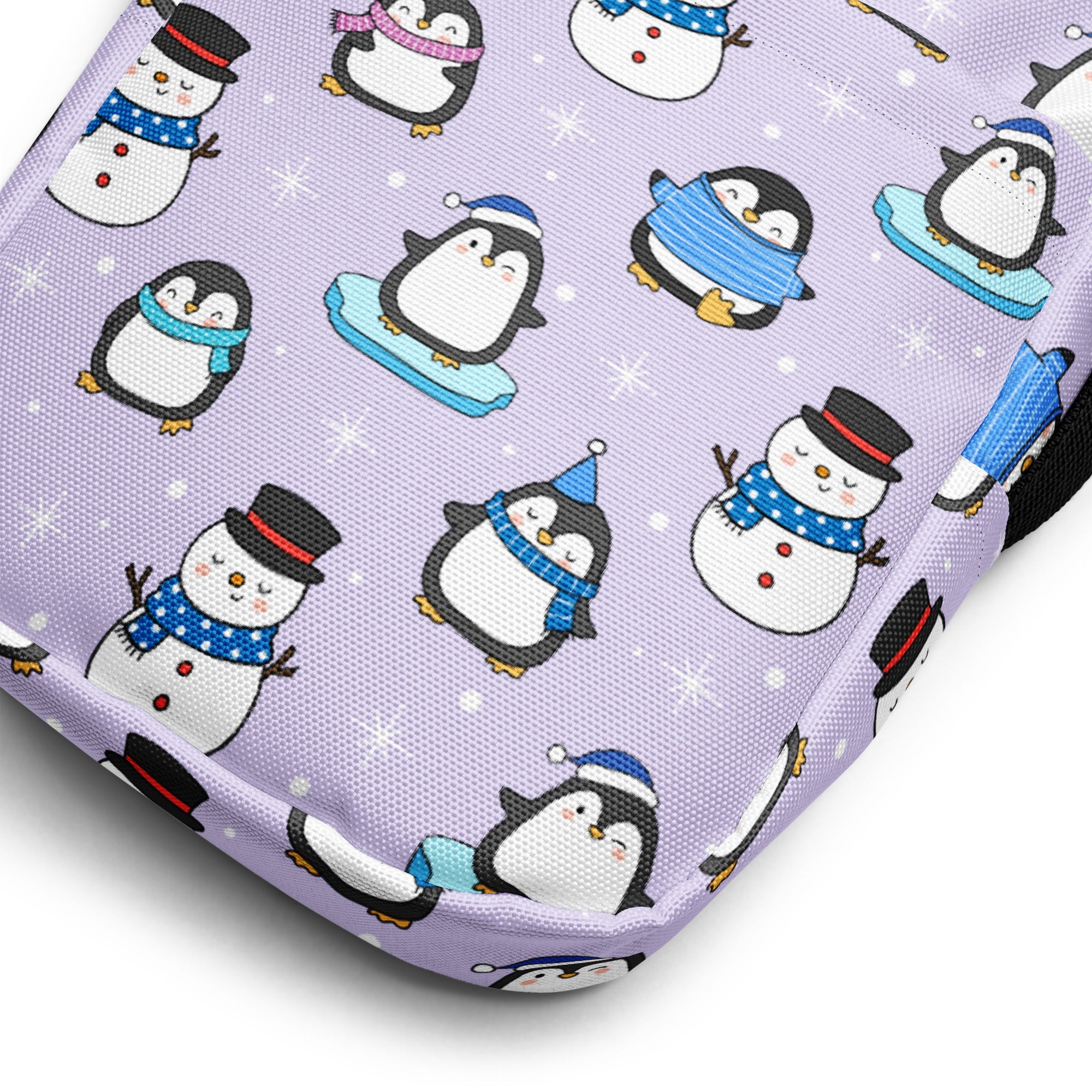 Lavender fabric girls winter penguin crossbody purse with playful cartoon penguins and snowmen pattern