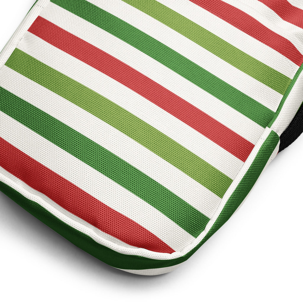 A christmas striped womens crossbody purse with bold red and green diagonal stripes on white durable fabric