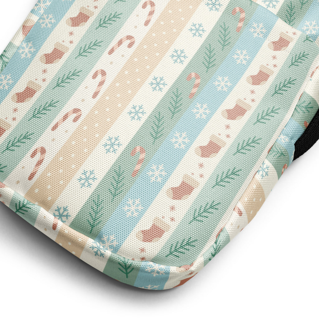 Girls pastel striped christmas crossbody purse with soft quilted fabric and festive candy cane and pine branch pattern