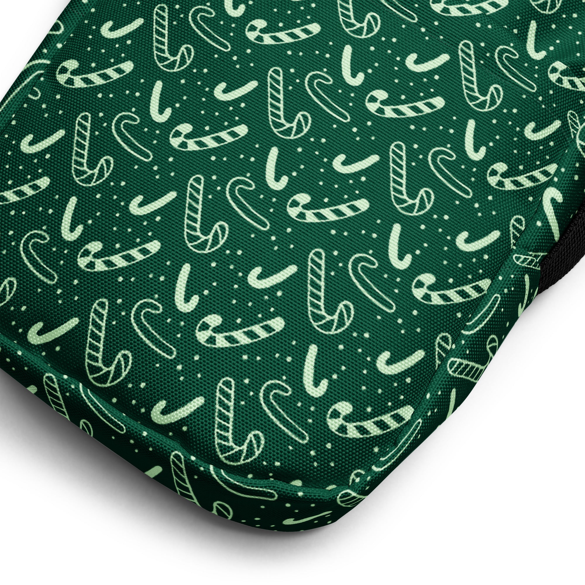 Girls green candy cane christmas crossbody purse made of dark green fabric with white candy cane pattern and small dots
