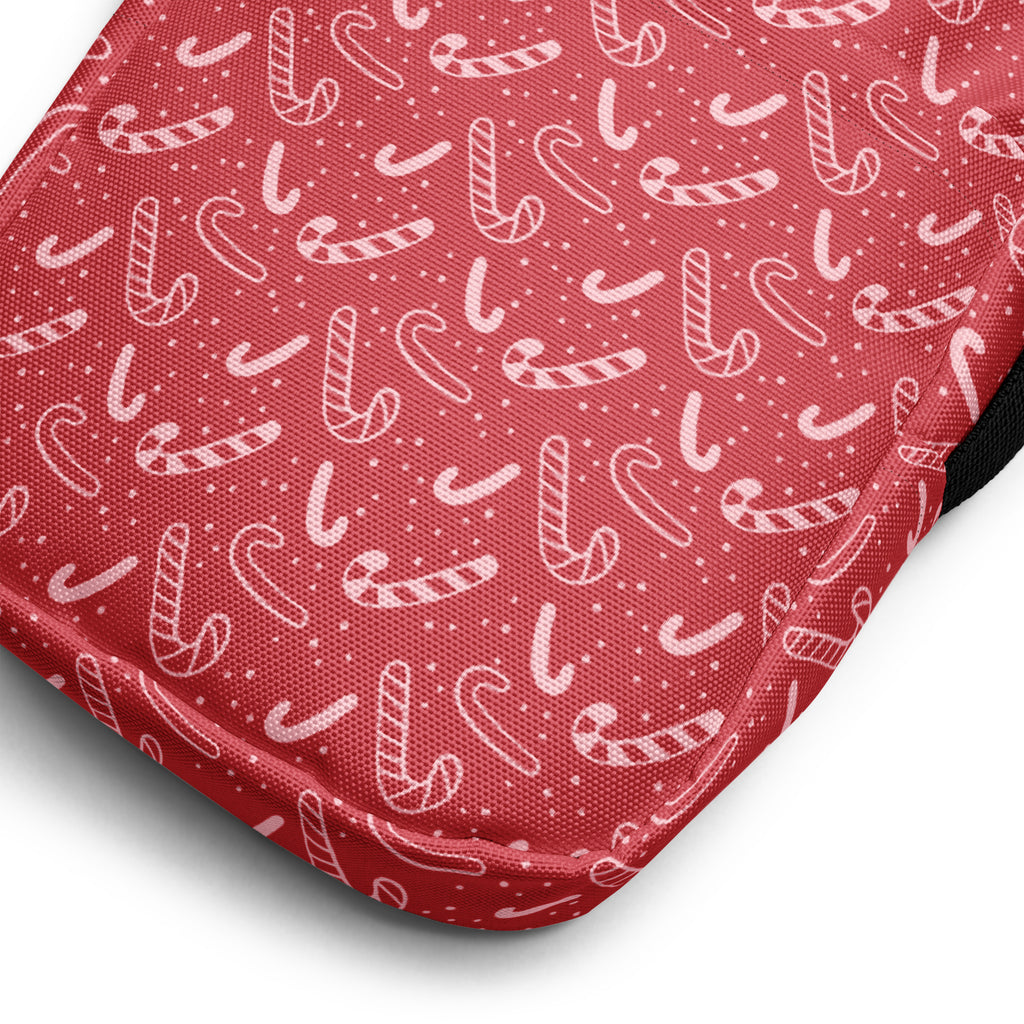 Girls red candy cane christmas crossbody purse with red fabric pouch decorated with white candy cane patterns and dots