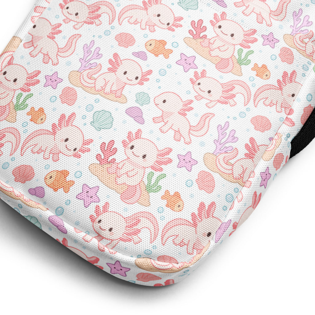 A white fabric girls axolotl crossbody purse with a cute pink axolotl and pastel sea creatures pattern