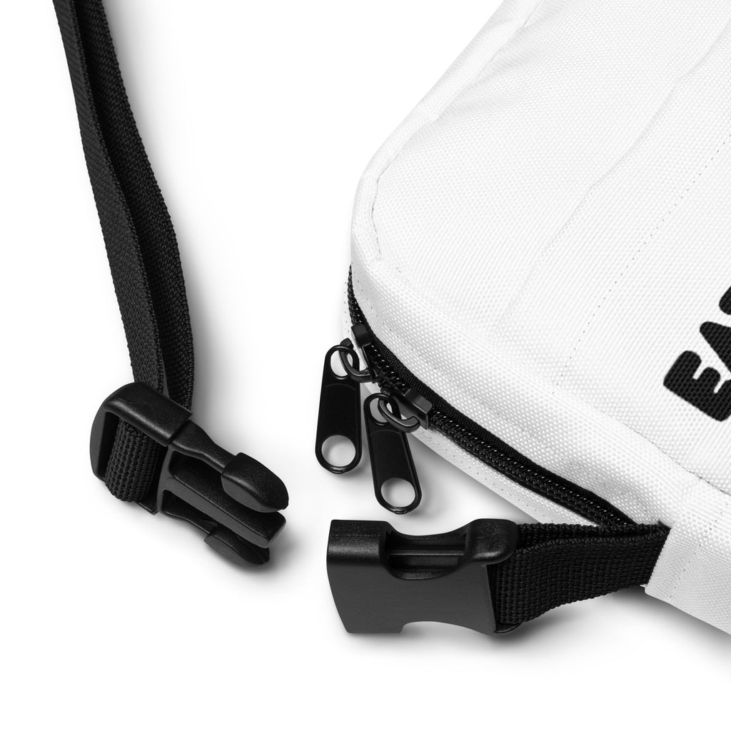 White canvas girls eat sleep gymnastics repeat crossbody purse with black zipper pulls and adjustable strap hardware