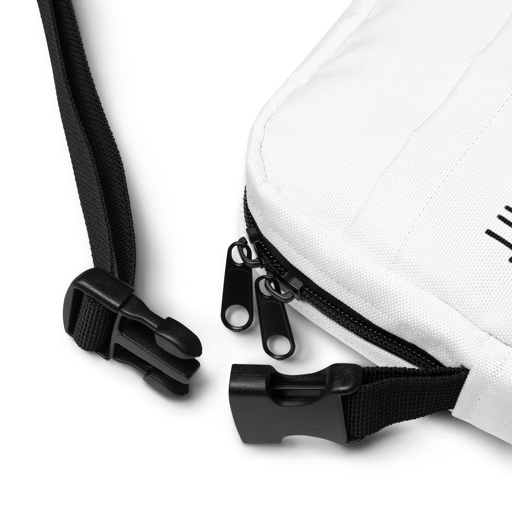 White canvas crossbody bag with black zipper pulls and adjustable strap for girls who love dogs