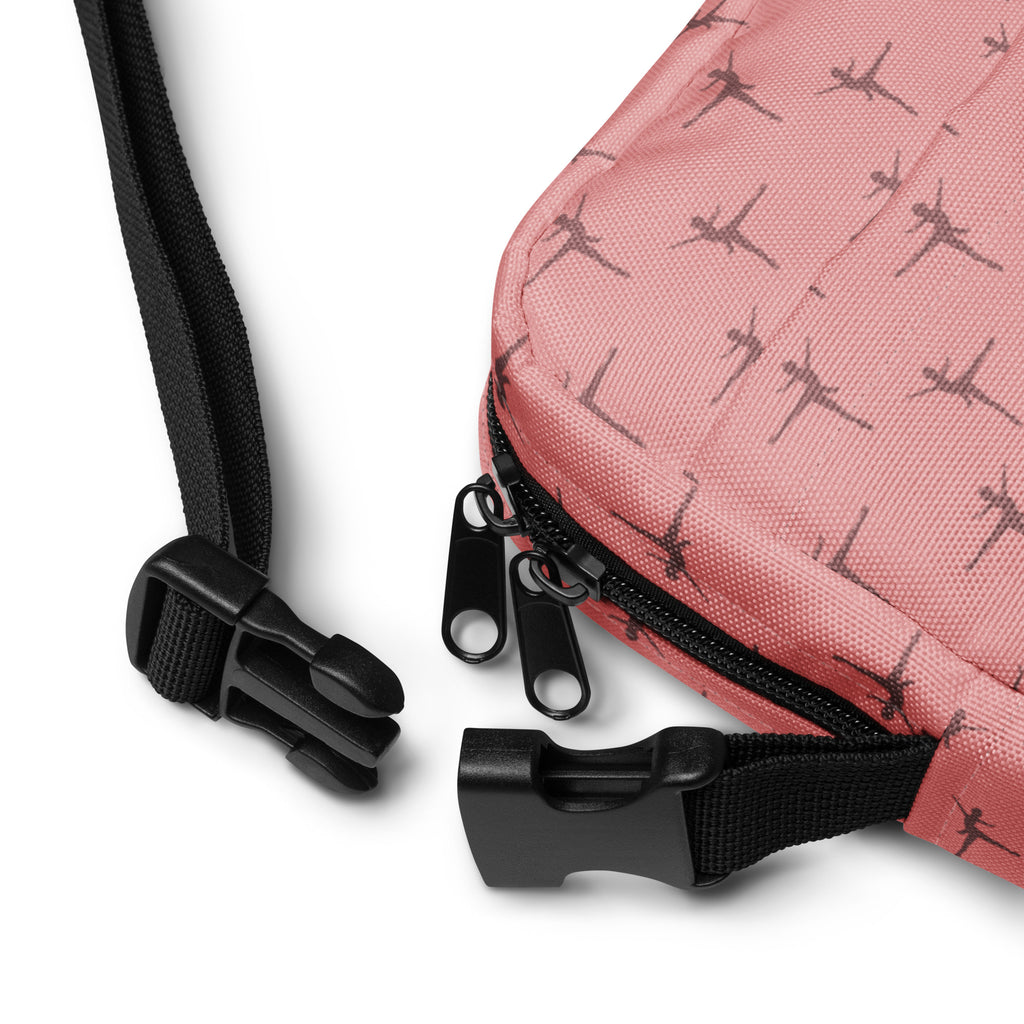 Girls ballet dancer crossbody purse in pink patterned fabric with black zippers and adjustable strap for easy wear