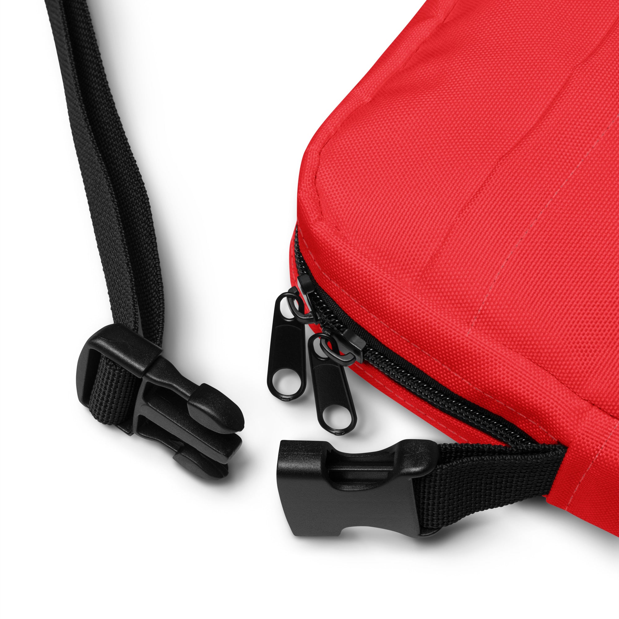 Girls red crossbody purse made of red fabric with a black zipper and adjustable strap for easy carrying