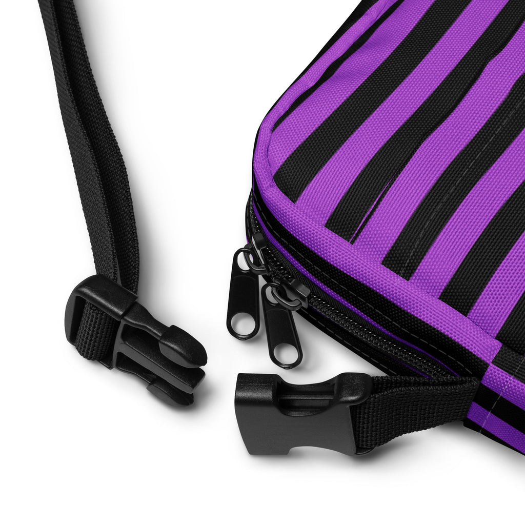 Girls purple and black striped Halloween crossbody purse with black zippers and adjustable straps for easy carrying