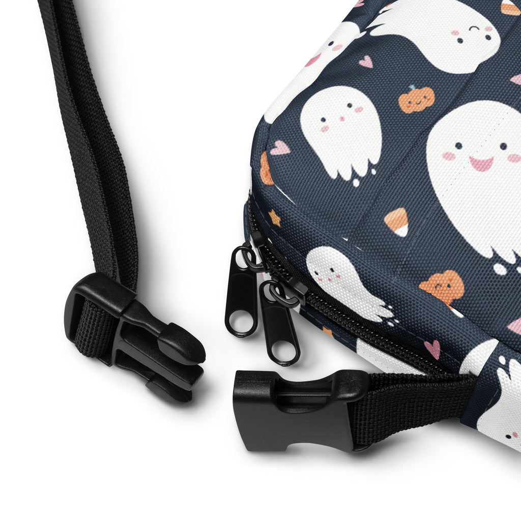 A navy blue kids ghost halloween crossbody purse with white cartoon ghosts orange pumpkins and pink hearts pattern