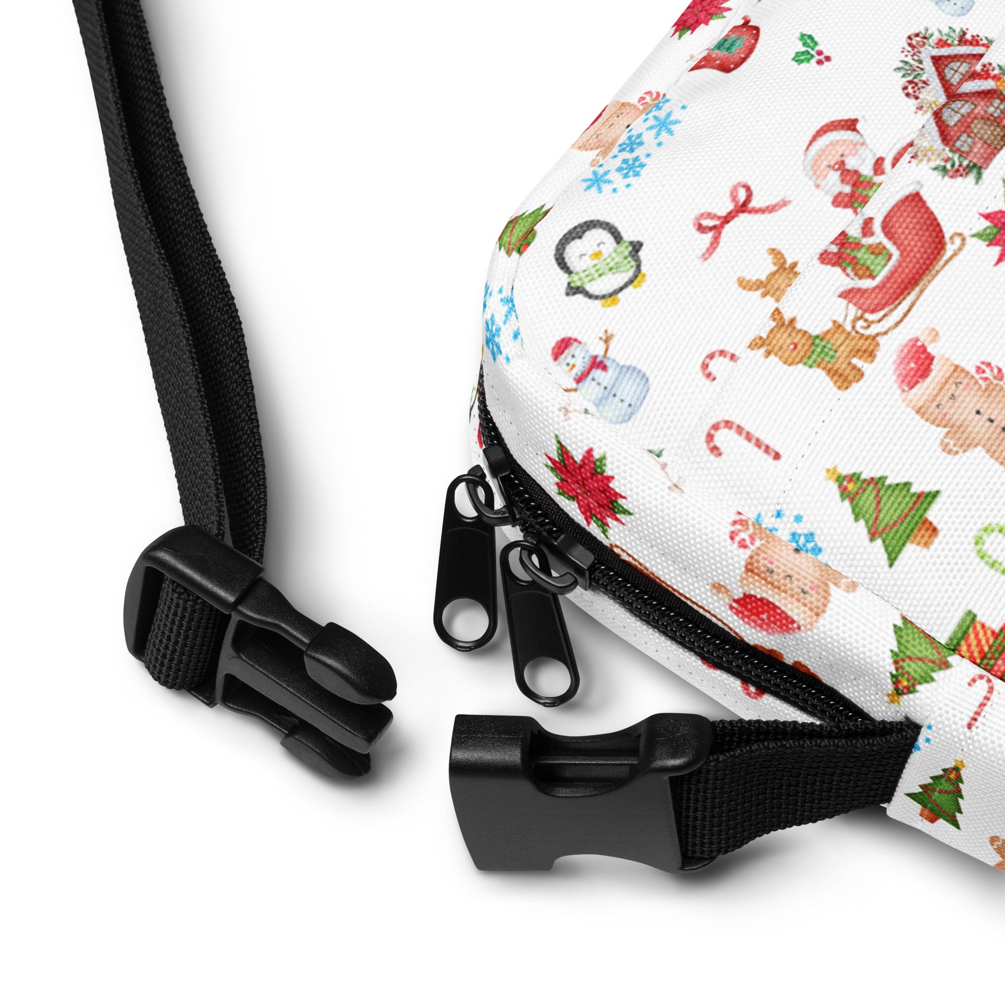White canvas crossbody bag with festive santa, penguins, snowmen, and candy canes holiday illustrations