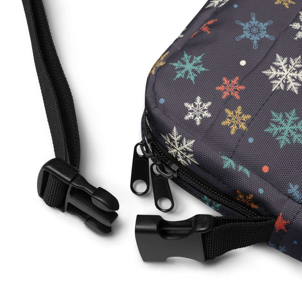 Girls colorful snowflakes crossbody purse made of dark gray fabric with white blue orange and yellow snowflake pattern