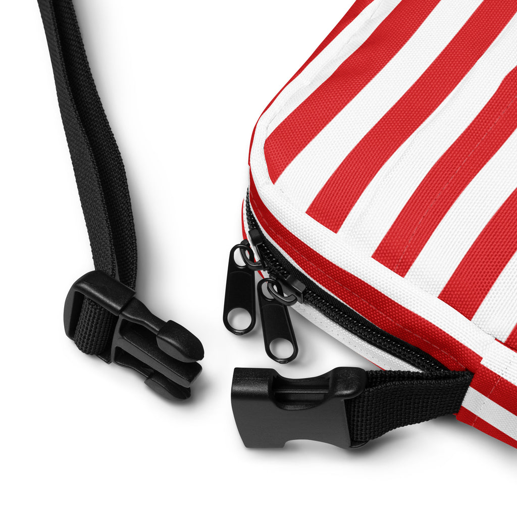 Red and white candy stripe canvas crossbody purse with black zipper pulls and adjustable strap for women