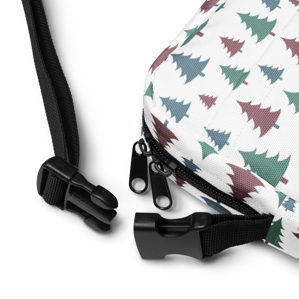 White canvas crossbody bag with festive green and maroon pine tree pattern for christmas winter use