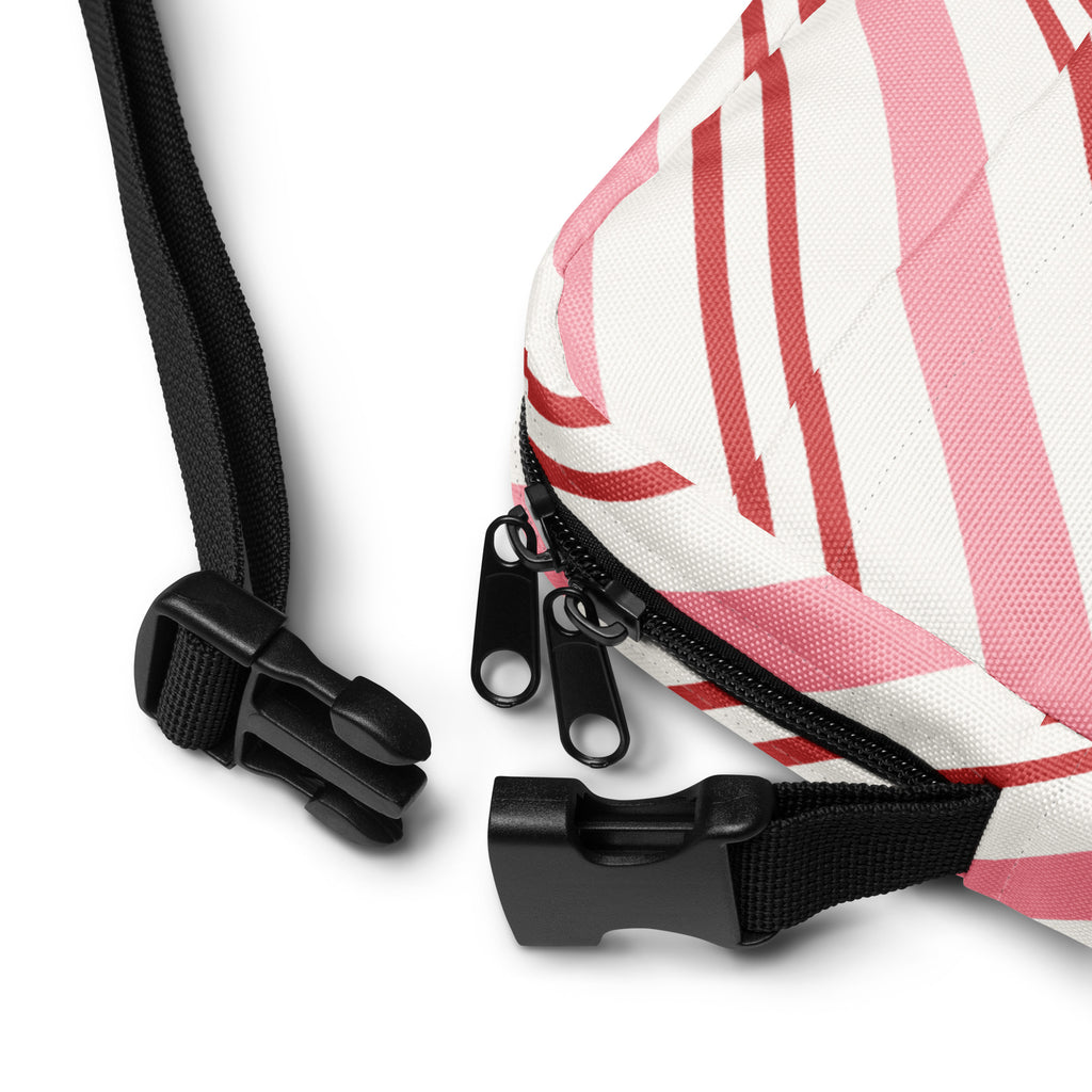 Girls pink and red candy stripe quilted crossbody purse with black zipper pulls and adjustable straps