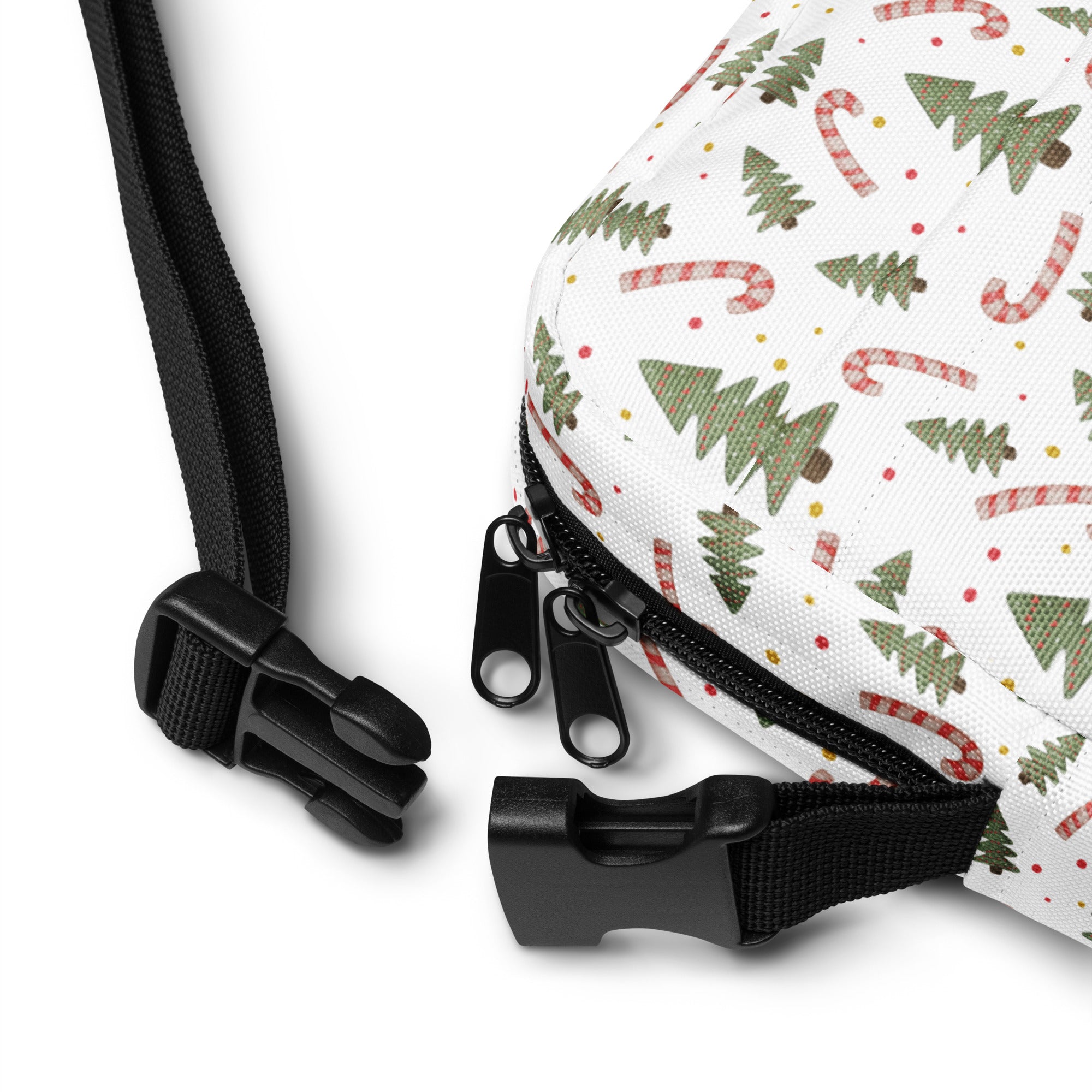White canvas girls crossbody bag with festive green pine trees and red and white candy canes pattern