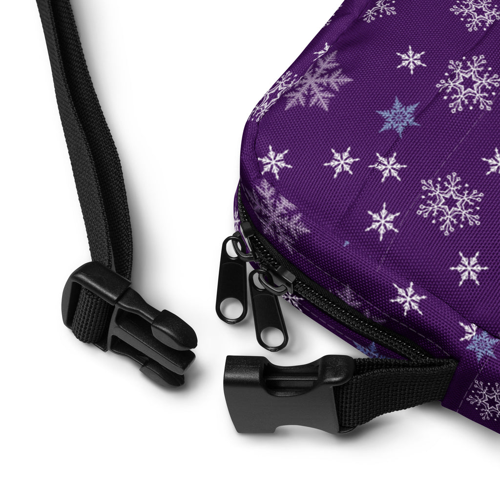 Christmas purple snowflake winter women’s crossbody purse with white and light blue snowflake pattern and adjustable straps