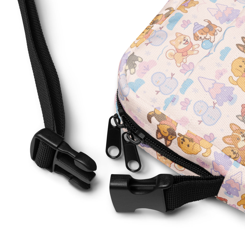 Pastel pink canvas crossbody bag with playful cartoon dogs balloons and party hats perfect for christmas use