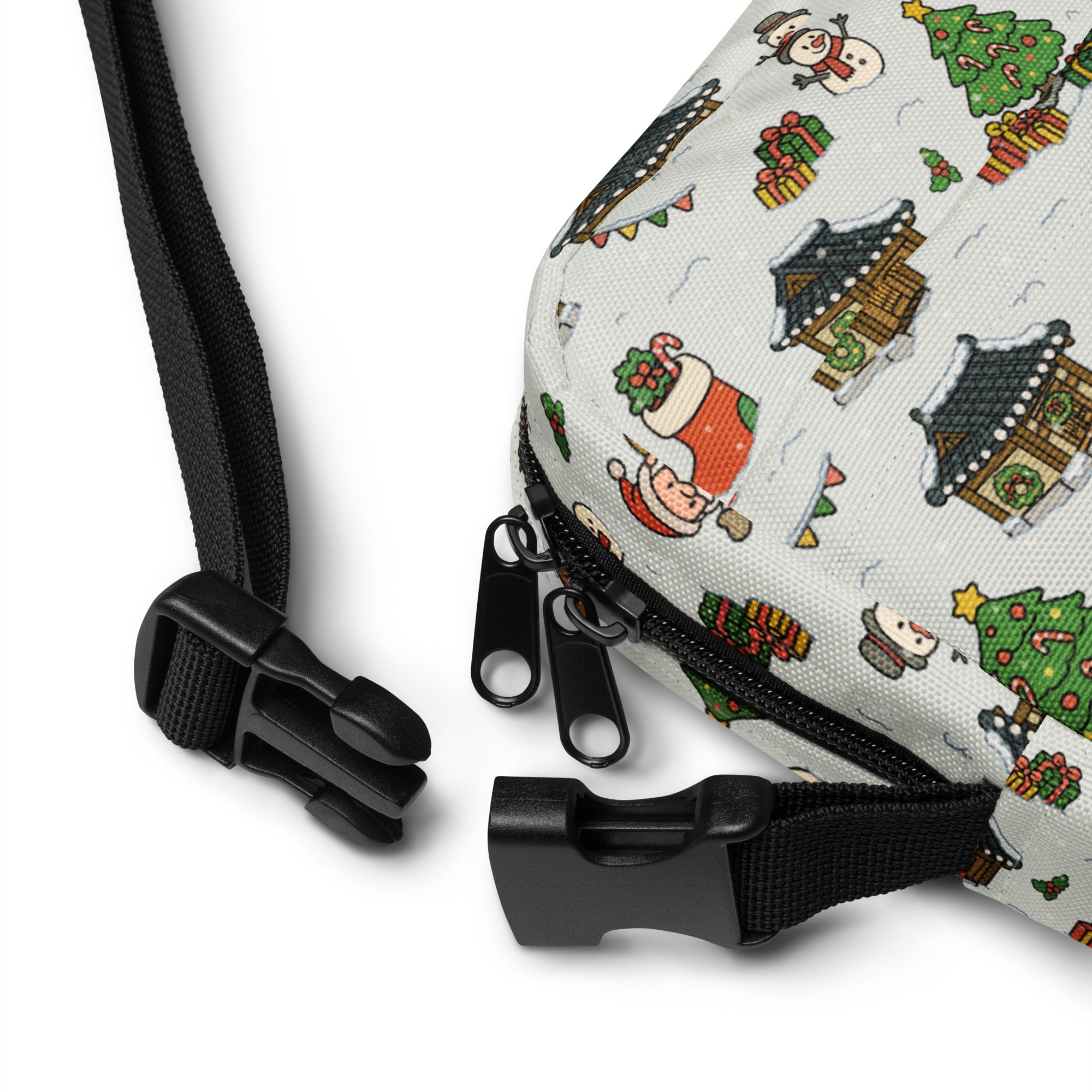 A festive white canvas crossbody bag with cheerful holiday print featuring snowmen christmas trees and santa claus