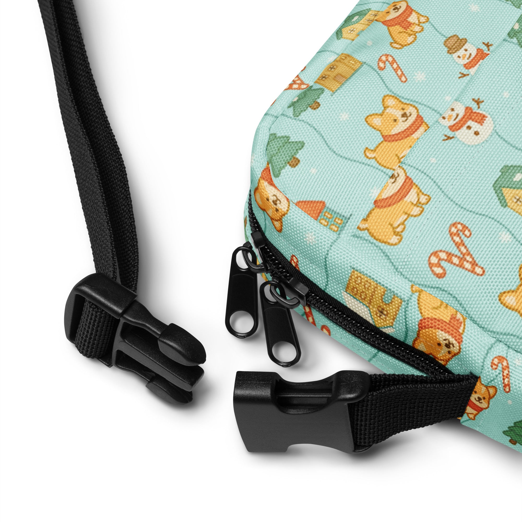 A light blue fabric girls corgi winter wonderland crossbody purse with festive orange corgi and holiday patterns