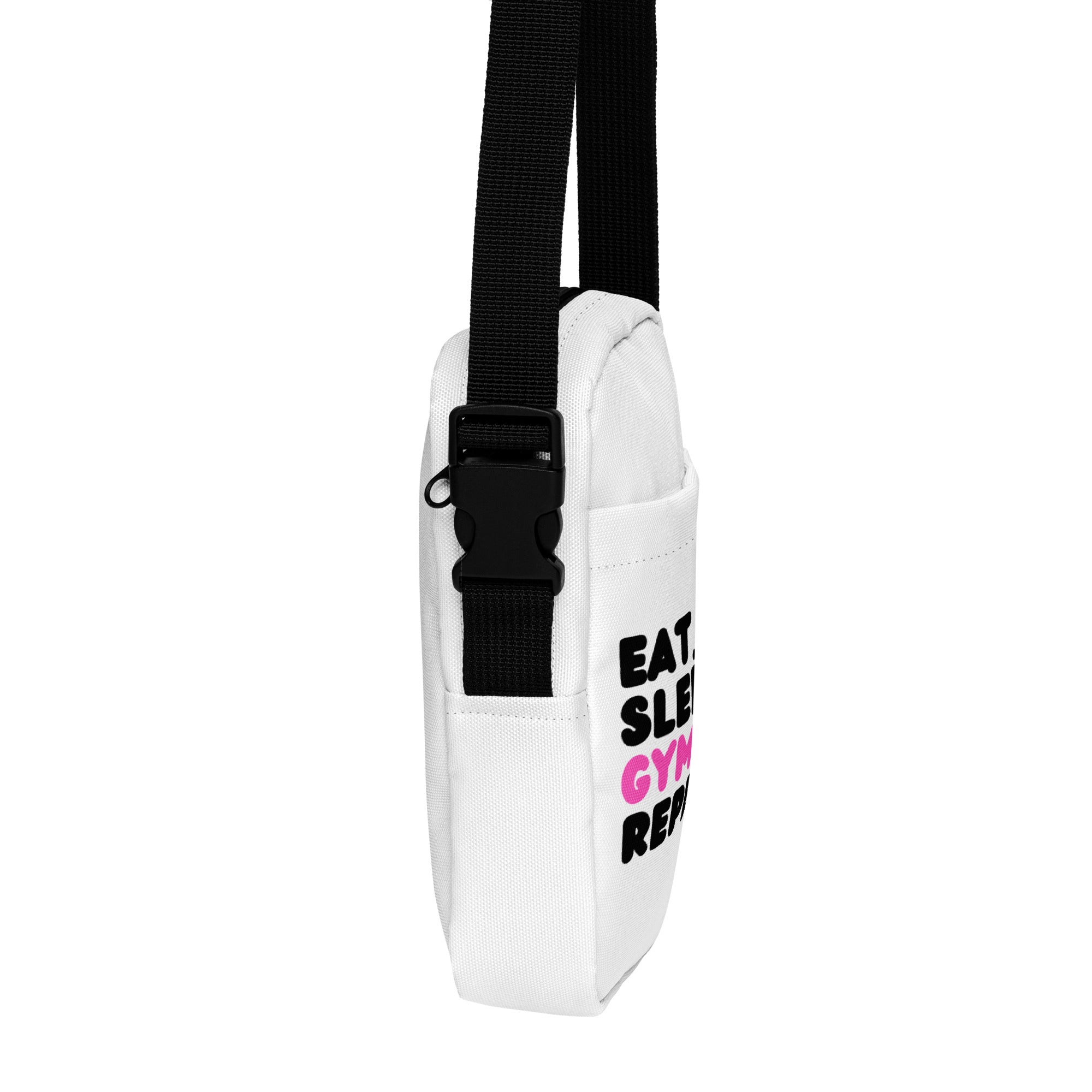 Girls Eat Sleep Gymnastics Repeat white canvas crossbody bag with black adjustable strap and pink black text design