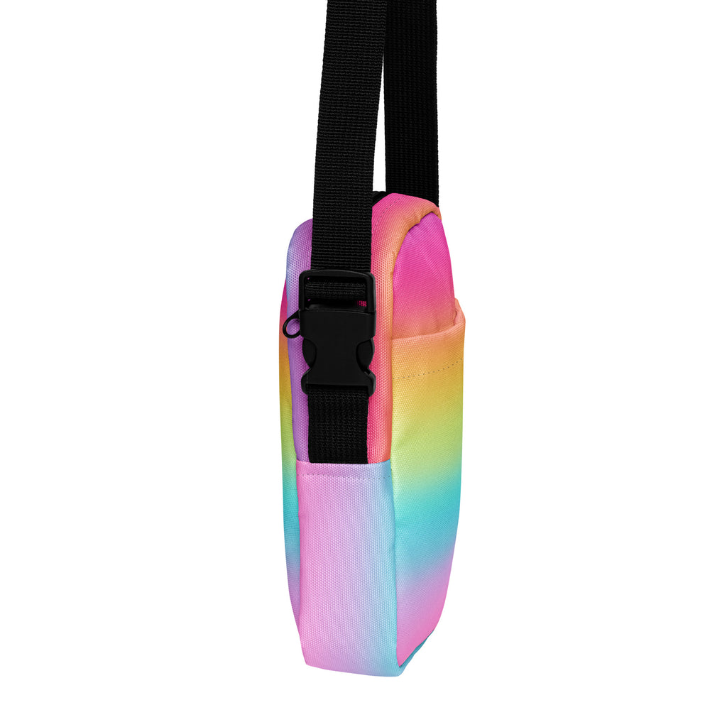 Girls bright rainbow crossbody purse made of rainbow gradient fabric with black adjustable strap and buckle